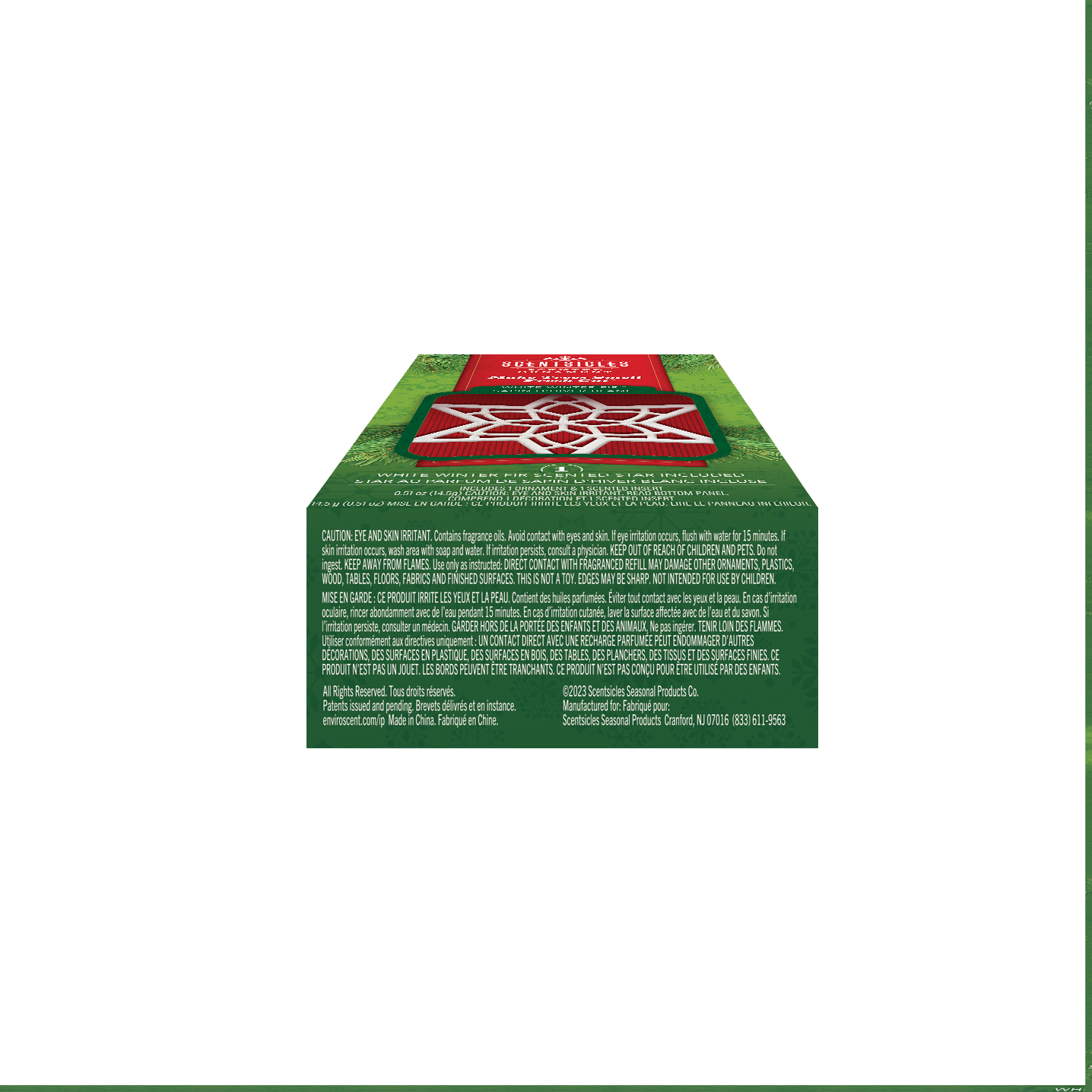 Bottom view of the Scentsicles 'White Winter Fir' scented ornament packaging. The green box displays safety warnings and usage instructions in both English and French. It includes details on avoiding contact with eyes and skin, keeping the product out of reach of children and pets, and safe disposal. The red label on top highlights the product's purpose, making trees smell fresh-cut, with an image of the white star ornament prominently featured.