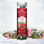 Scentsicles 'Christmas Berry' scented ornaments in a festive jar with a red label, nestled among snow-covered pine branches and berries, capturing the essence of a fresh-cut Christmas tree.